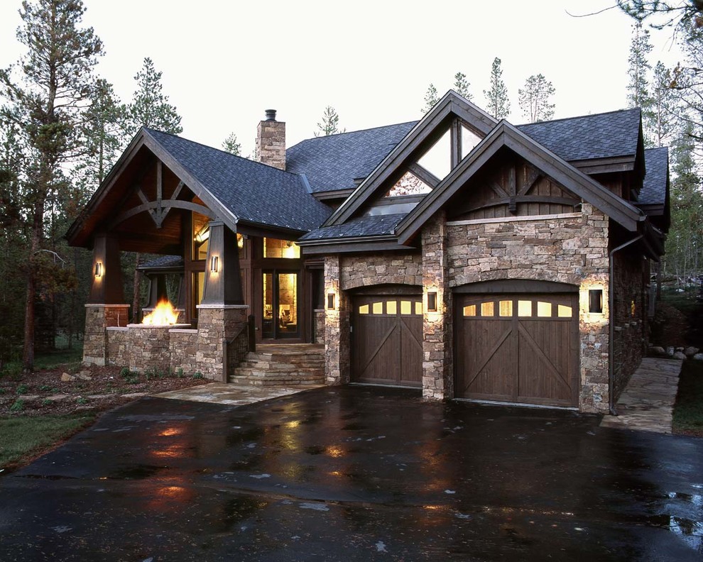 Mid-sized traditional two-storey brown exterior in Denver with stone veneer.