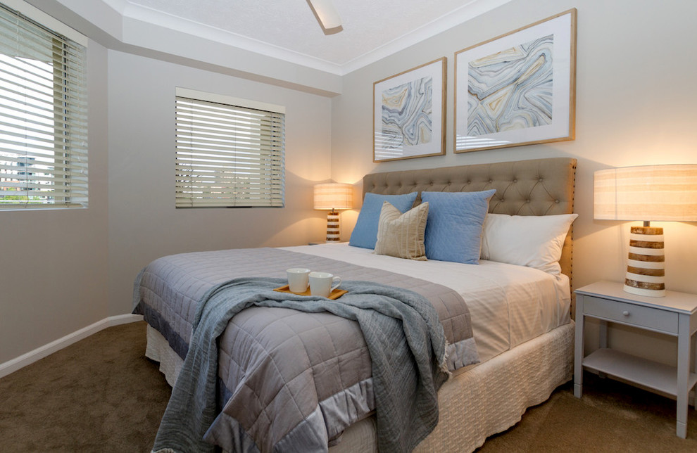Design ideas for a mid-sized transitional master bedroom in Brisbane with grey walls, carpet and beige floor.