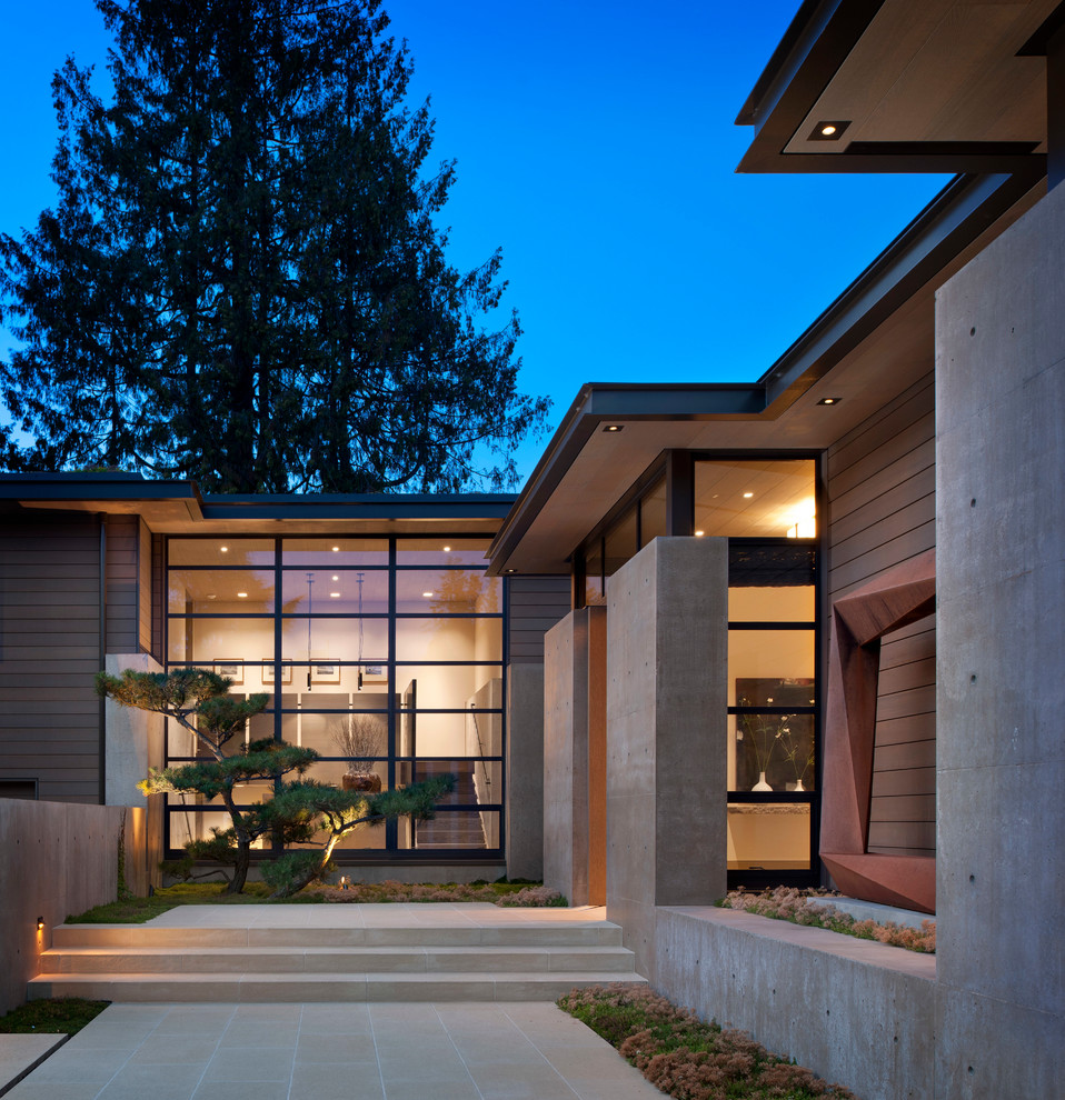 Design ideas for a contemporary one-storey exterior in Seattle with wood siding.