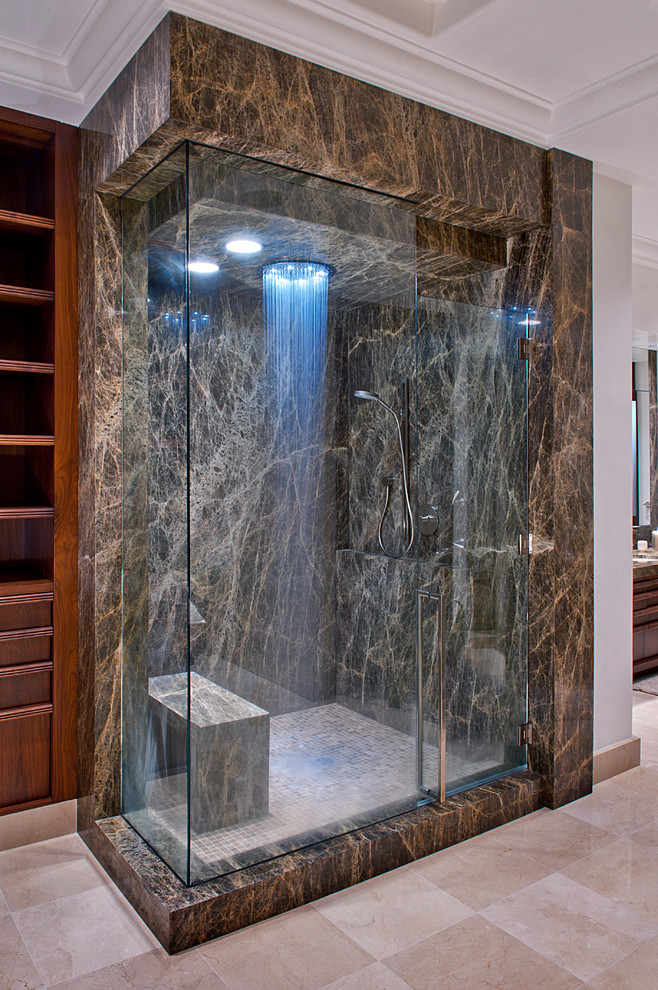 This is an example of a contemporary bathroom in Oklahoma City with a corner shower, brown tile and a shower seat.