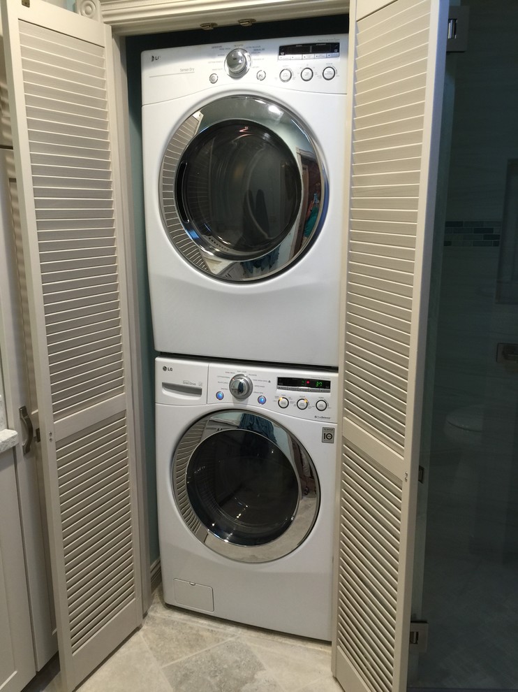 Inspiration for a mid-sized transitional gray tile and porcelain tile ceramic tile and gray floor laundry room remodel in Phoenix with shaker cabinets, white cabinets, blue walls, an undermount sink, granite countertops and a hinged shower door