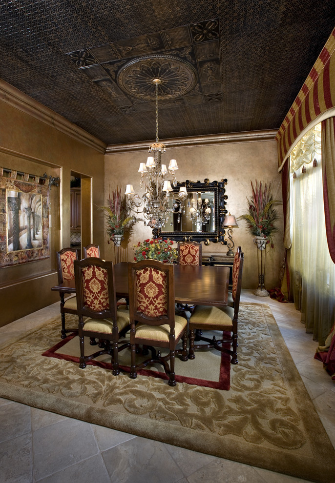 This is an example of a mediterranean separate dining room in Phoenix with brown walls.