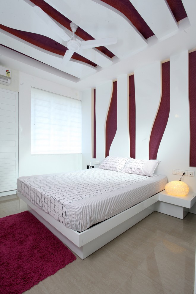 Design ideas for a contemporary bedroom in Other with multi-coloured walls.