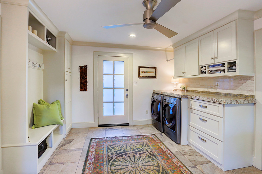 Photo of a large modern galley utility room in Houston with recessed-panel cabinets, beige cabinets, granite benchtops, porcelain floors and a side-by-side washer and dryer.