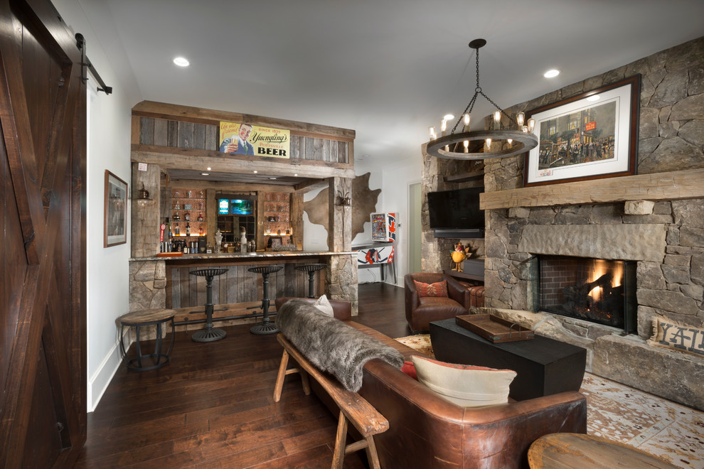 This is an example of a country home bar in Other.