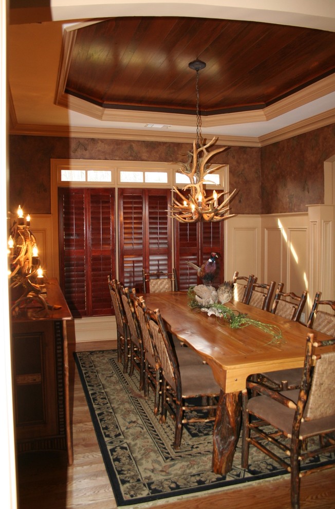 Photo of a large country dining room in Atlanta with beige walls and a standard fireplace.