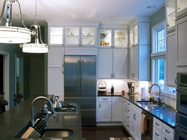 Transitional l-shaped eat-in kitchen photo in Indianapolis with an undermount sink, recessed-panel cabinets, white cabinets, granite countertops and stainless steel appliances