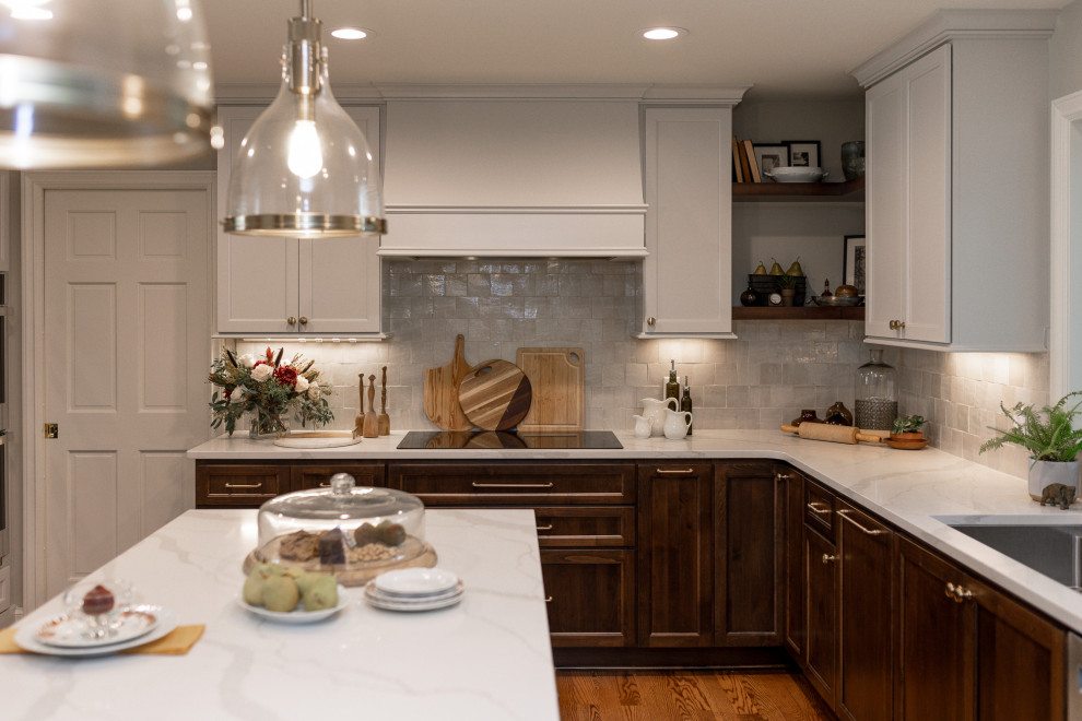 Eat-in kitchen - mid-sized transitional l-shaped medium tone wood floor and brown floor eat-in kitchen idea with an undermount sink, recessed-panel cabinets, medium tone wood cabinets, quartz countertops, beige backsplash, terra-cotta backsplash, stainless steel appliances, an island and white countertops