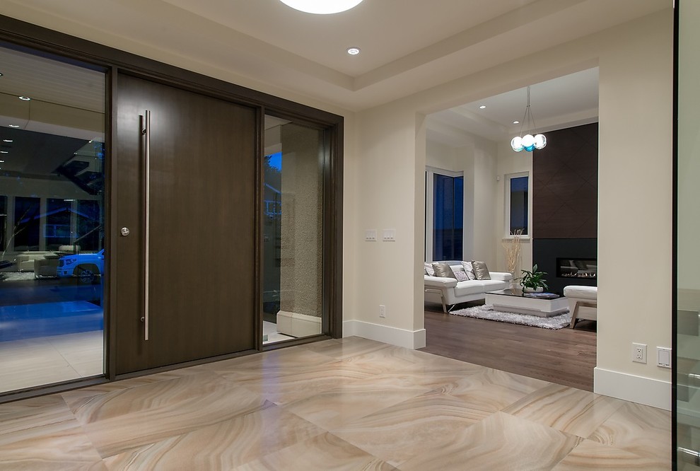 Inspiration for a large transitional foyer in Phoenix with white walls, marble floors, a pivot front door and a dark wood front door.