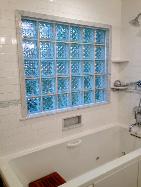 Example of a mid-sized transitional 3/4 blue tile, gray tile, white tile and subway tile gray floor drop-in bathtub design in Chicago with white walls, an integrated sink, white cabinets, glass countertops and furniture-like cabinets