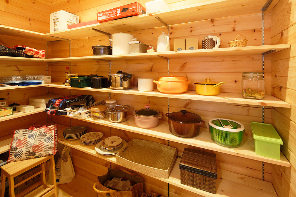 This is an example of a country kitchen pantry in Other.