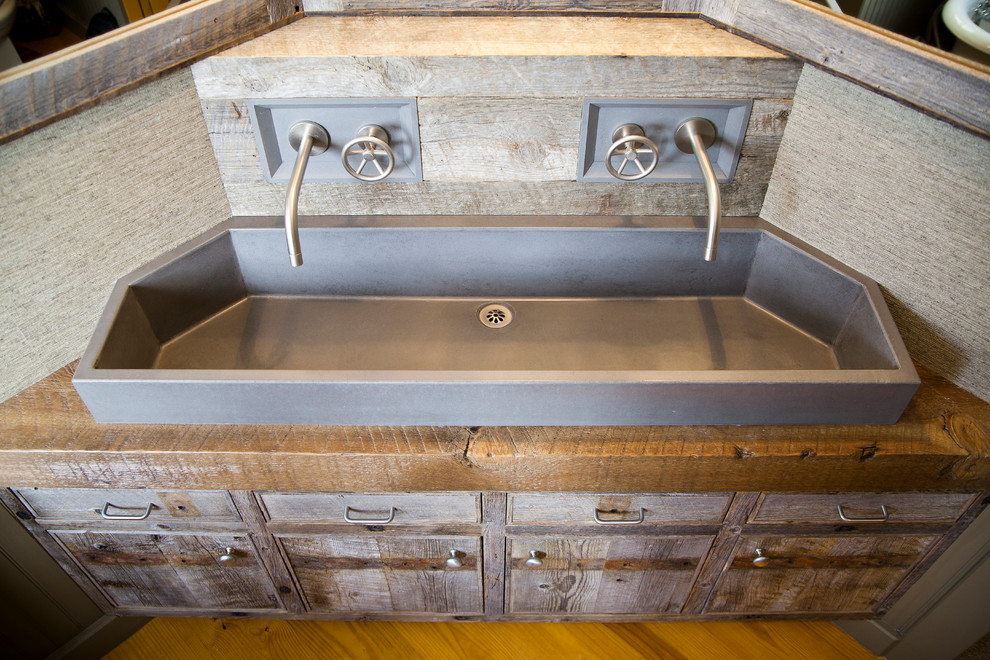 Inspiration for a rustic bathroom remodel with a trough sink and wood countertops