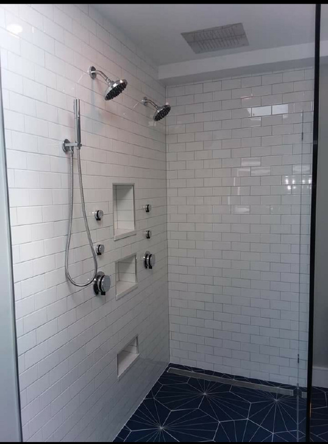 Traditional shower room bathroom in DC Metro with recessed-panel cabinets, black cabinets, an alcove bath, a shower/bath combination, white tiles, metro tiles, white walls, a submerged sink, multi-coloured floors, a shower curtain and white worktops.