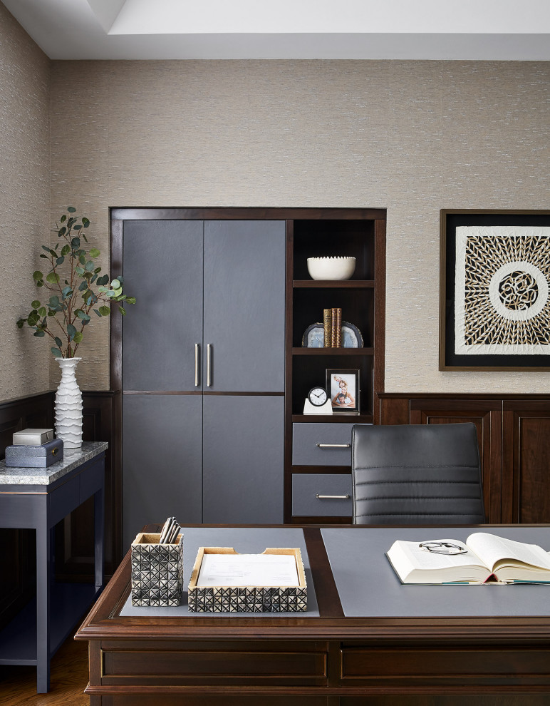 This is an example of a large transitional study room in Chicago with grey walls, dark hardwood floors, a ribbon fireplace, a stone fireplace surround, a freestanding desk, brown floor, vaulted and panelled walls.