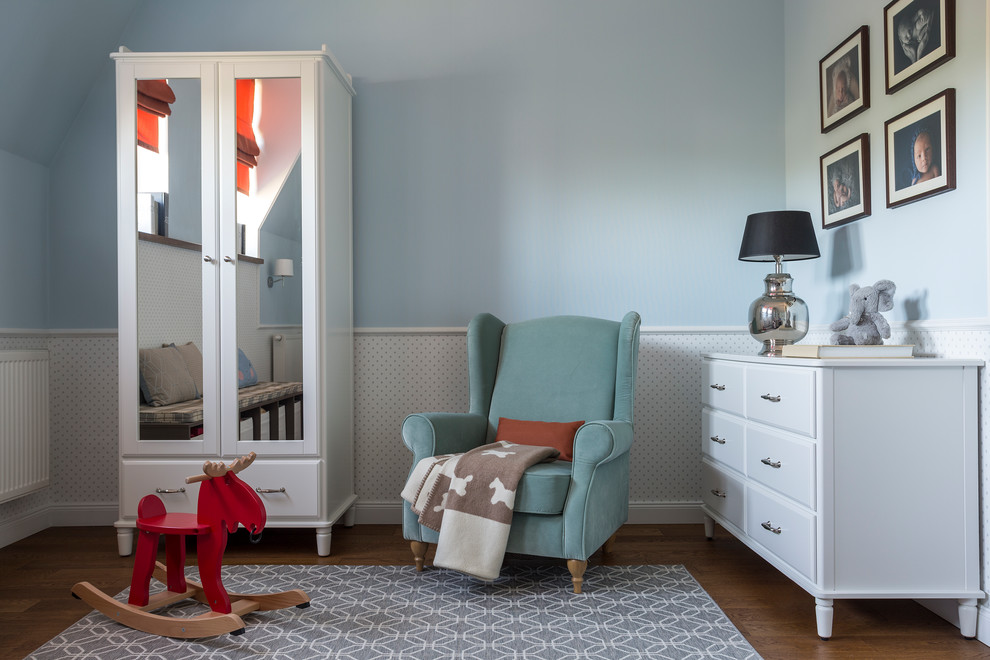 This is an example of a traditional gender-neutral kids' room in Moscow with blue walls, medium hardwood floors and brown floor.