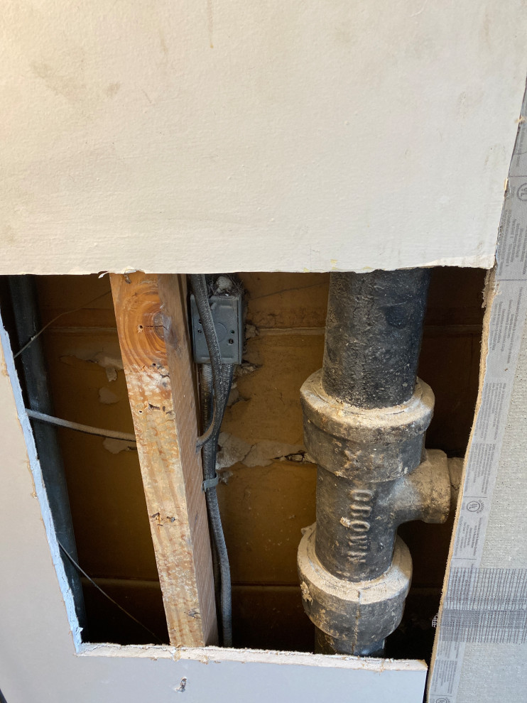 How do I drywall around a drain pipe?