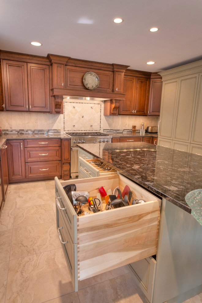 Example of a large transitional l-shaped ceramic tile eat-in kitchen design with an undermount sink, raised-panel cabinets, medium tone wood cabinets, glass countertops, multicolored backsplash, mosaic tile backsplash, paneled appliances and an island