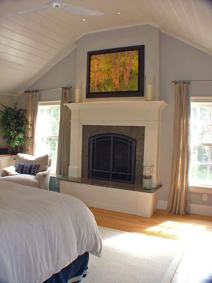 This is an example of a mid-sized traditional bedroom in Portland Maine.
