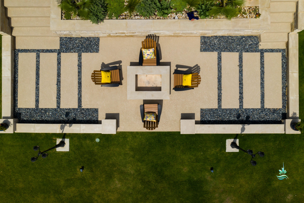 Inspiration for a huge mediterranean backyard custom-shaped infinity pool landscaping remodel in Dallas with decking