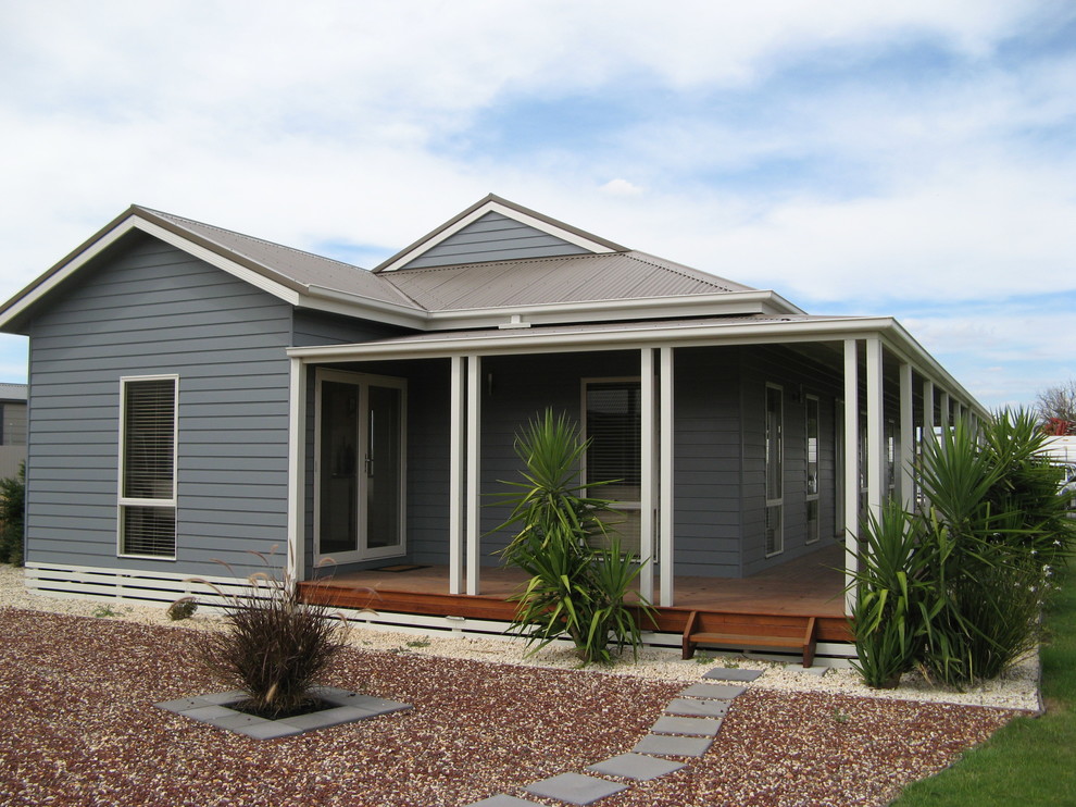 Inspiration for a large traditional one-storey grey exterior in Melbourne with concrete fiberboard siding.
