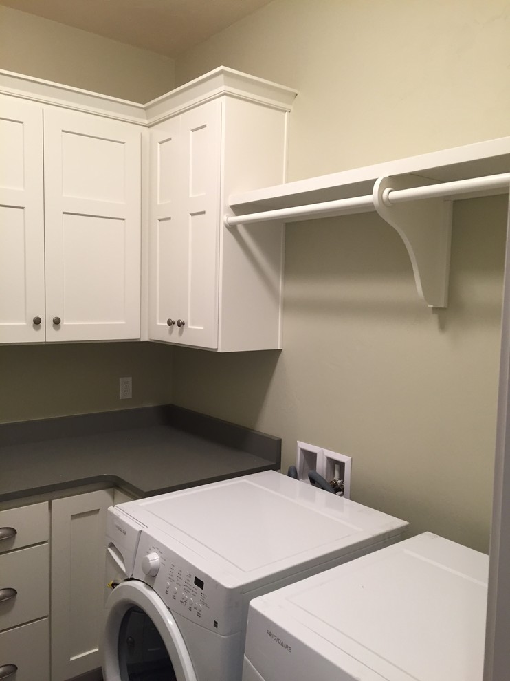 Design ideas for a transitional l-shaped utility room in Other with flat-panel cabinets.