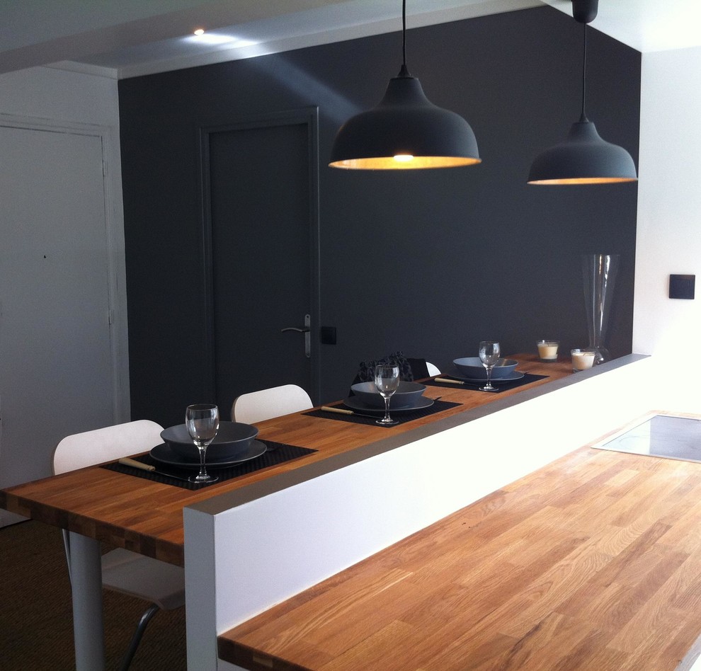 Design ideas for a scandinavian kitchen in Paris with wood benchtops.