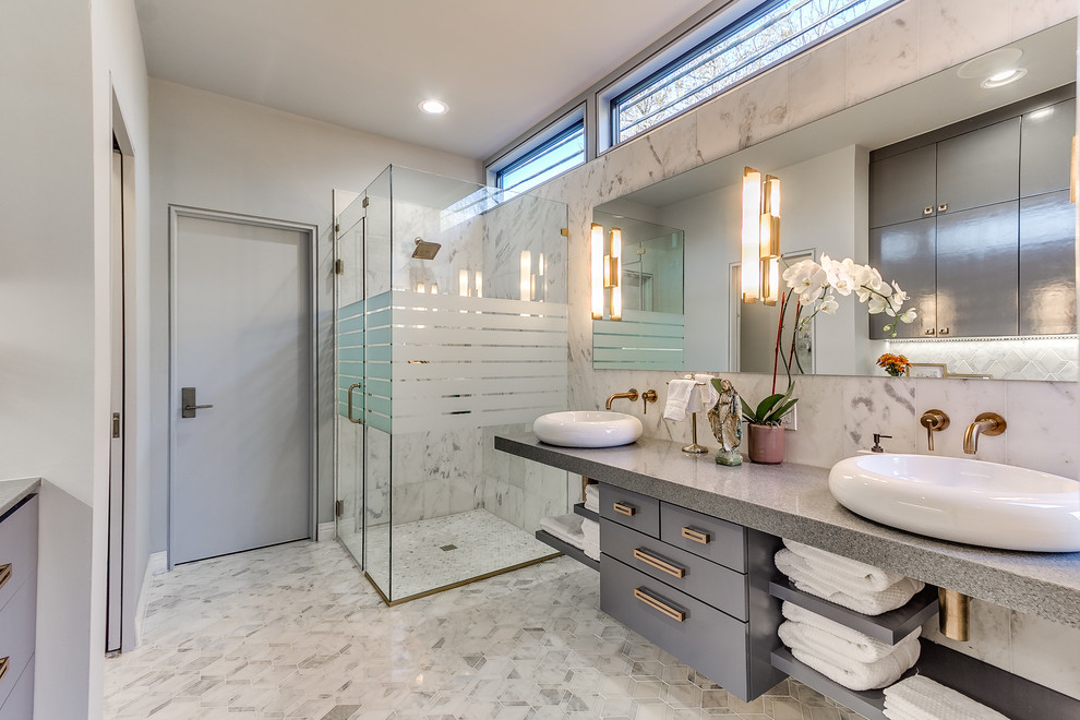 Design ideas for a contemporary bathroom in Oklahoma City with flat-panel cabinets, grey cabinets, a corner shower, white tile, grey walls, a vessel sink and grey benchtops.