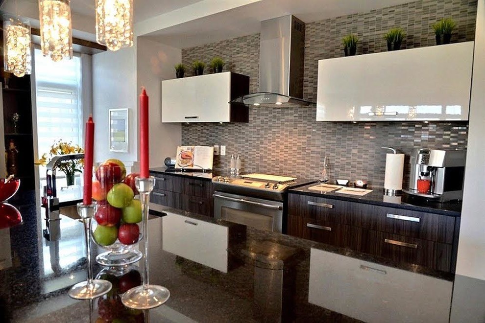 This is an example of a small modern open plan kitchen in Montreal with a double-bowl sink, glass benchtops, brown splashback, brick splashback, stainless steel appliances and with island.