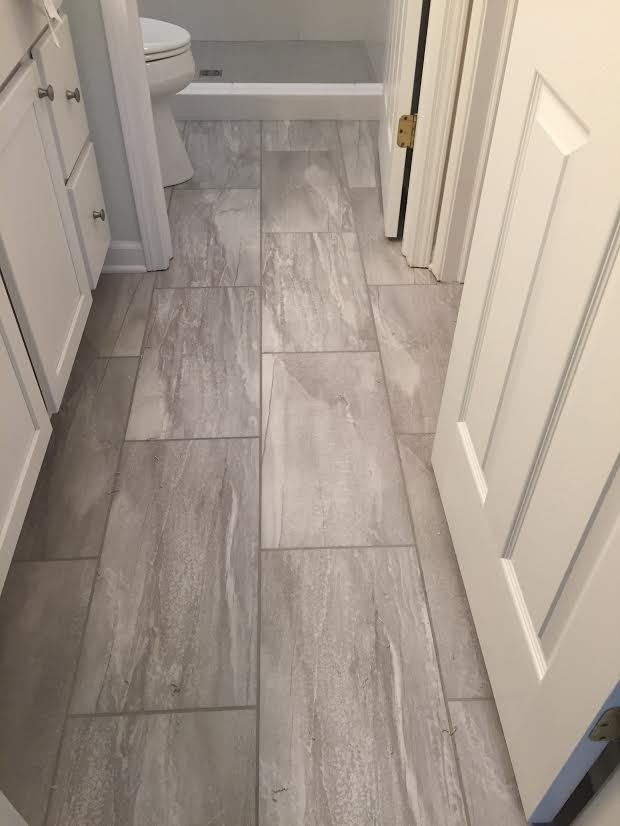 Example of a small transitional 3/4 gray tile, white tile and ceramic tile porcelain tile alcove shower design with shaker cabinets and white cabinets