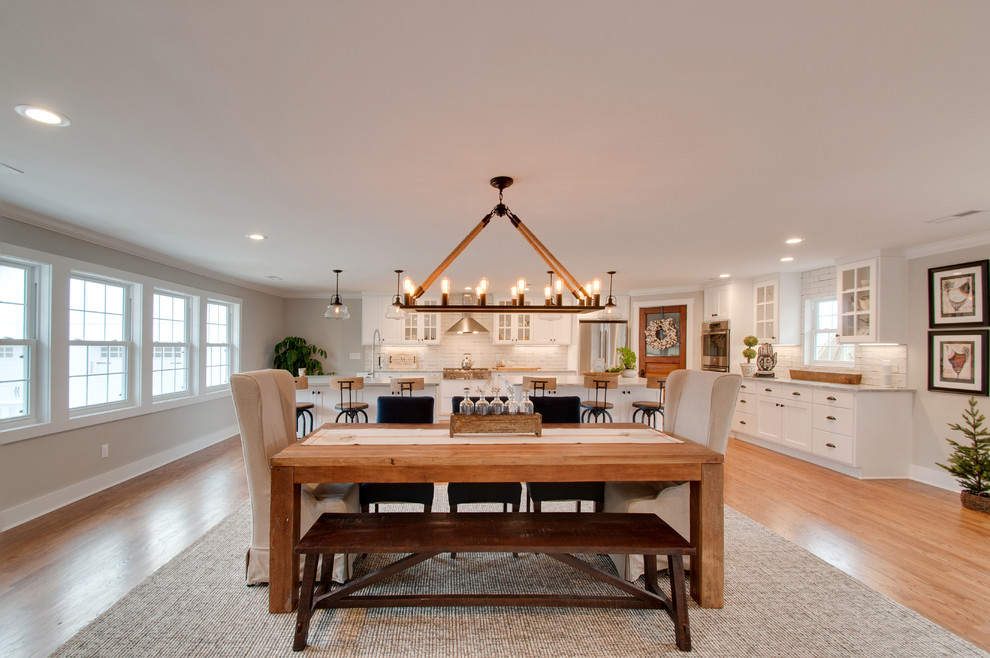 Inspiration for a large country open plan dining in Nashville with grey walls, medium hardwood floors and brown floor.