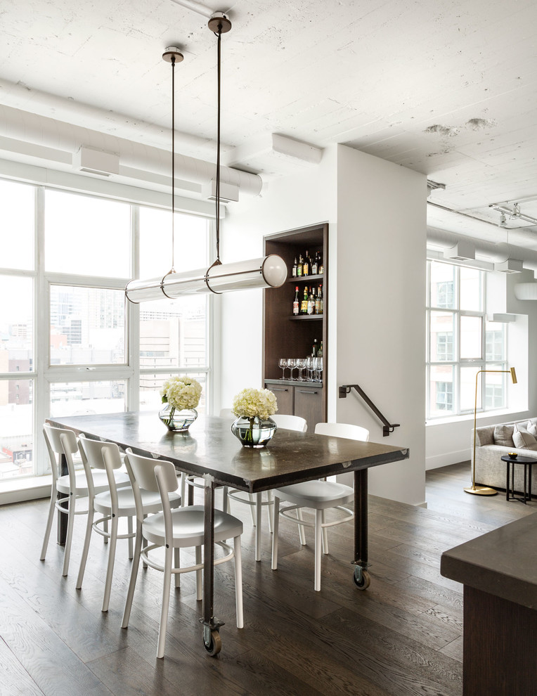 Inspiration for a mid-sized transitional open plan dining in Toronto with white walls, dark hardwood floors, no fireplace and brown floor.