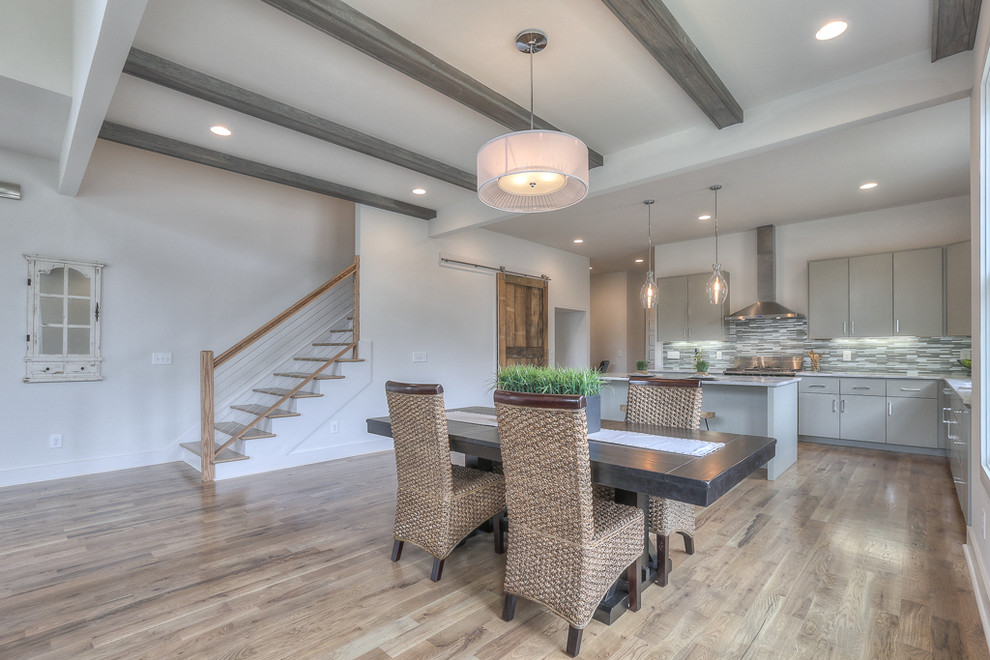 Great room - mid-sized transitional medium tone wood floor great room idea in Nashville with white walls