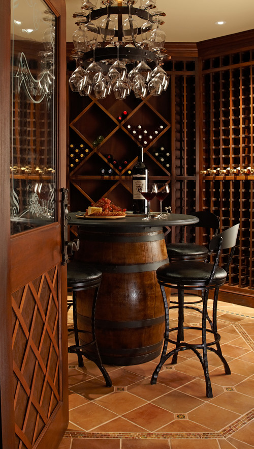 This wine cellar featuring a round pub table with four stools, making it the center of the wine cellar
