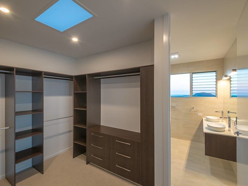 This is an example of a contemporary storage and wardrobe in Sunshine Coast.