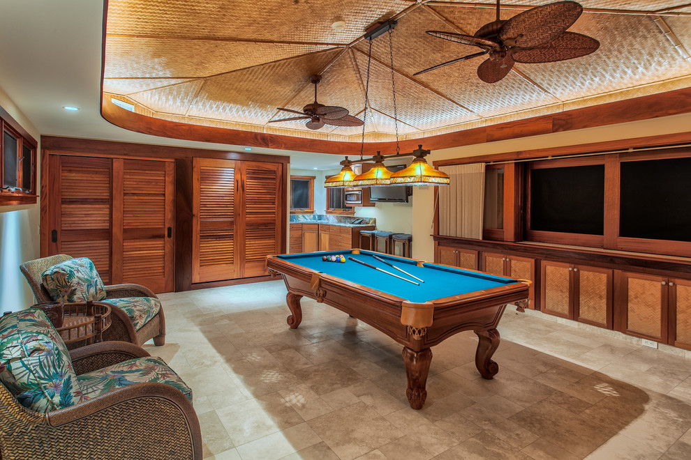 Inspiration for a large tropical family room in Hawaii with a game room and beige walls.