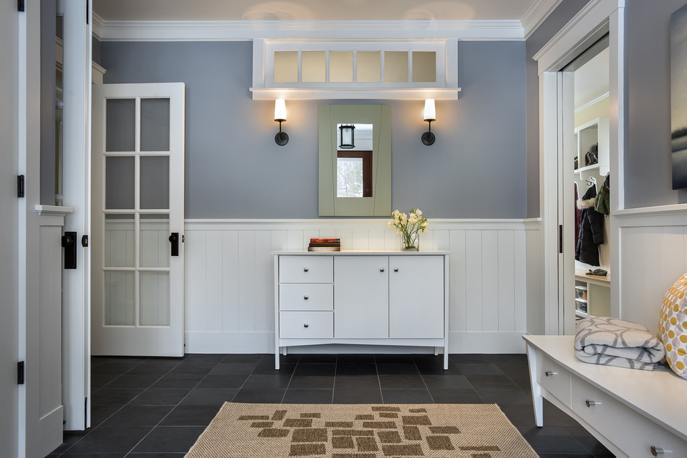 Large traditional foyer in Portland Maine with grey walls, slate floors, a single front door and a medium wood front door.