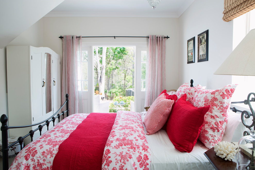 Design ideas for a beach style guest bedroom in Brisbane with white walls.