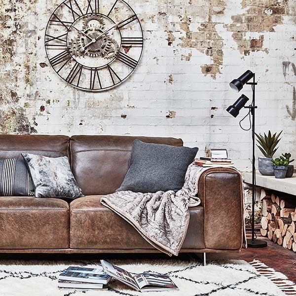Inspiration for an expansive industrial living room in Other with white walls, dark hardwood floors and brown floor.