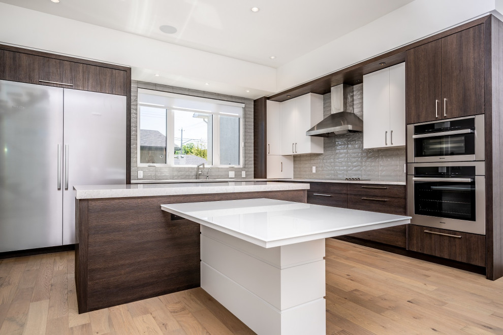 Example of a mid-sized transitional kitchen design in Calgary
