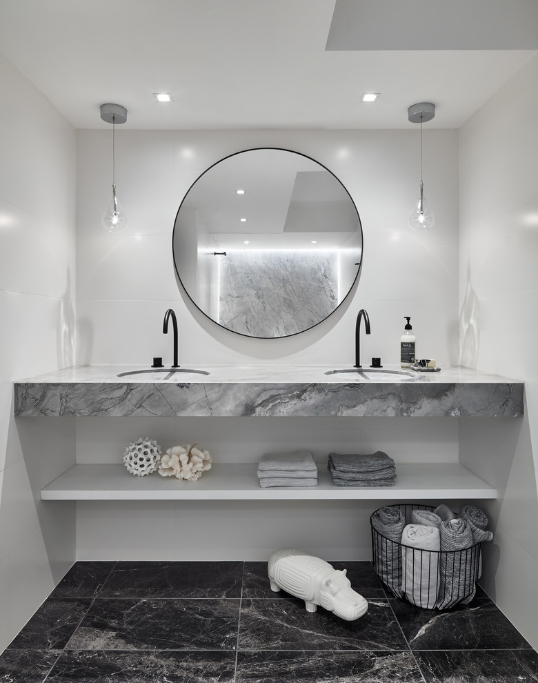 Photo of a small contemporary bathroom in Boston with an alcove shower, a one-piece toilet, white tile, porcelain tile, marble floors, an integrated sink, quartzite benchtops, open cabinets, grey cabinets, grey benchtops, a double vanity and a floating vanity.