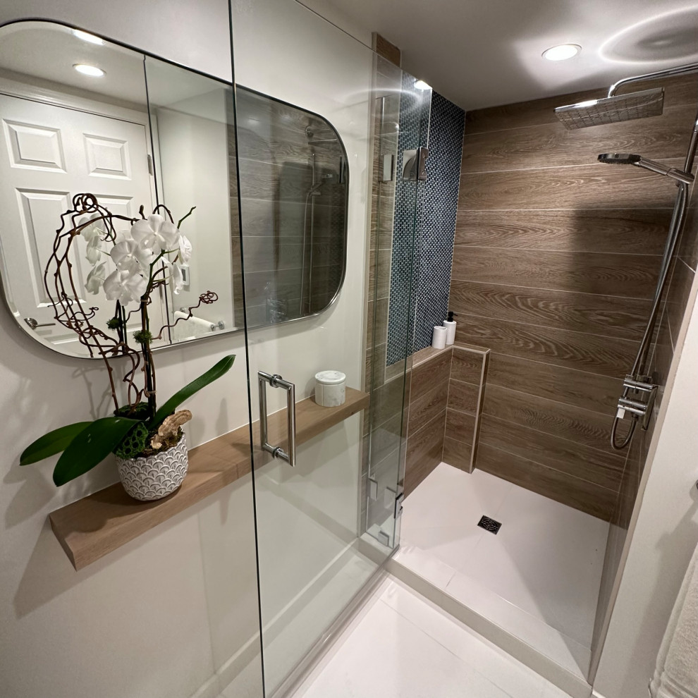 Example of a small danish brown tile and ceramic tile single-sink alcove shower design in San Francisco with flat-panel cabinets, white walls, solid surface countertops and a freestanding vanity