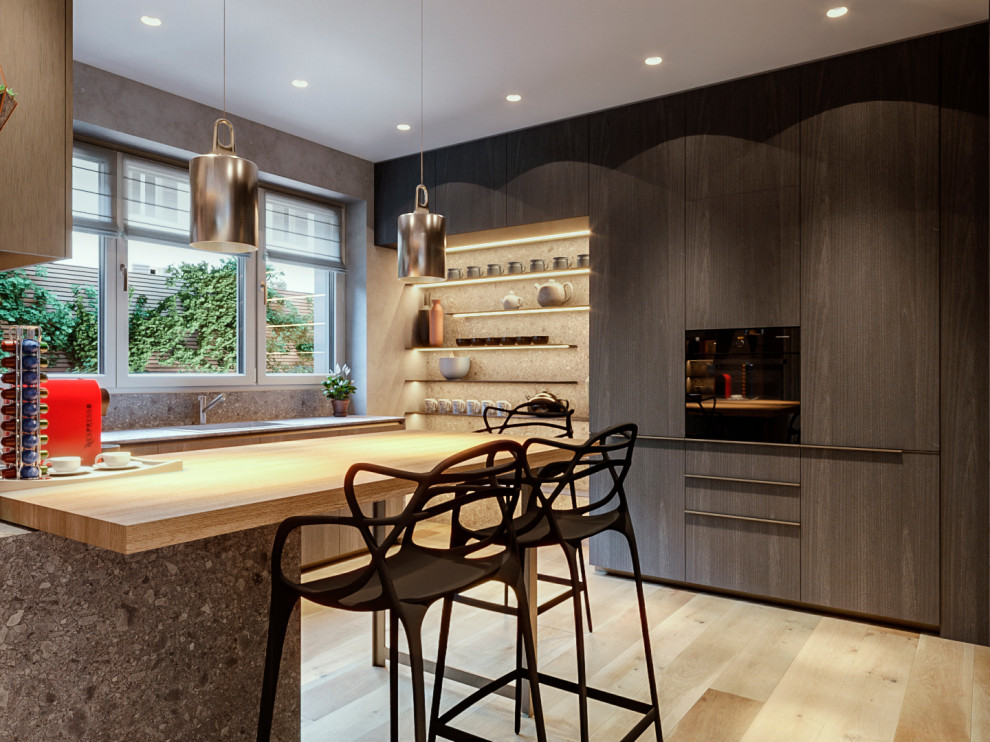 Photo of a mid-sized contemporary kitchen in Milan with an undermount sink, flat-panel cabinets, dark wood cabinets, quartz benchtops, black appliances, a peninsula, beige floor, grey benchtop and recessed.