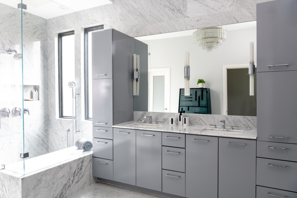 Photo of a midcentury bathroom in Austin with flat-panel cabinets, grey cabinets, a corner shower, grey tiles, a submerged sink, grey floors, a hinged door, grey worktops, double sinks and a built in vanity unit.