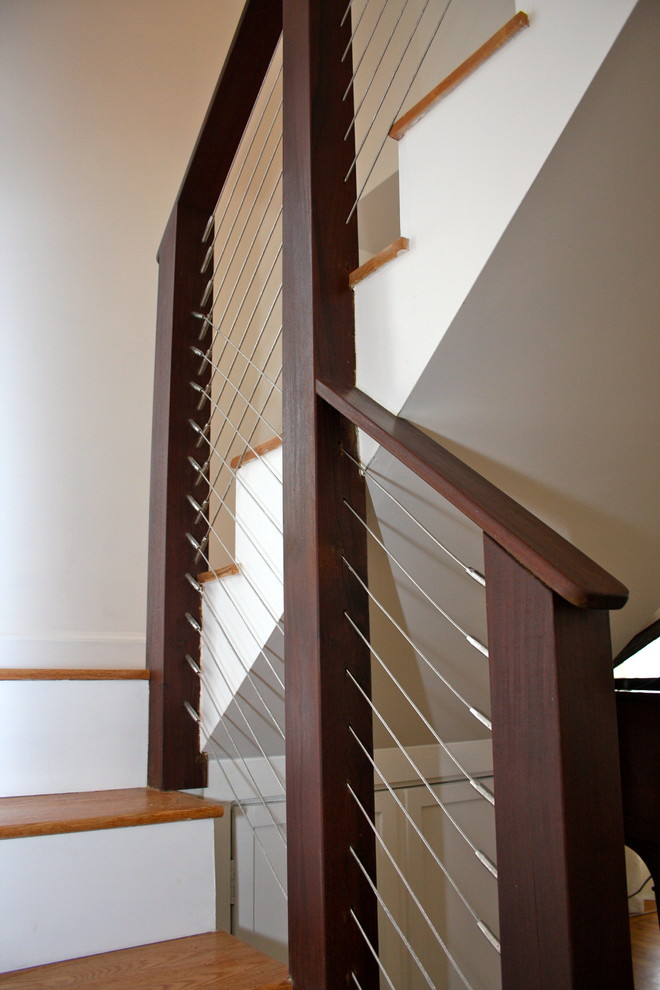 Design ideas for a mid-sized transitional wood u-shaped staircase in Boston with painted wood risers.