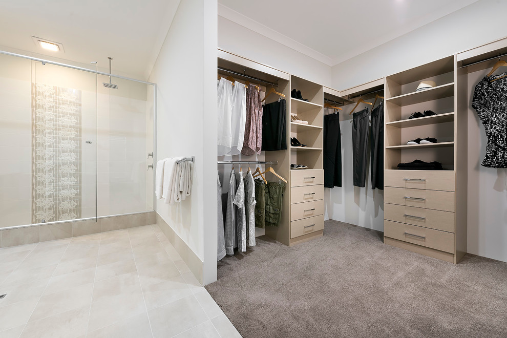 Design ideas for a large contemporary gender-neutral walk-in wardrobe in Perth with open cabinets, light wood cabinets and carpet.