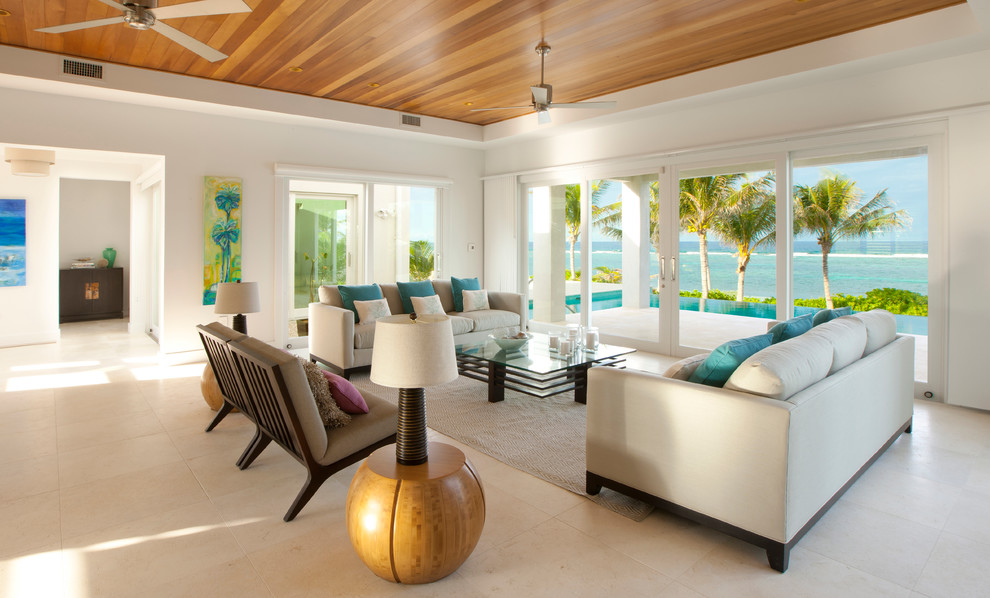 Photo of a tropical open concept living room in Other with porcelain floors.