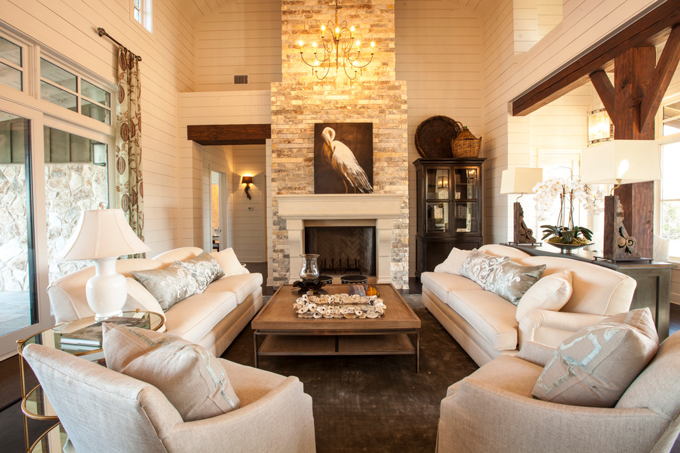 Design ideas for a country living room in Austin with beige walls, a standard fireplace and a stone fireplace surround.
