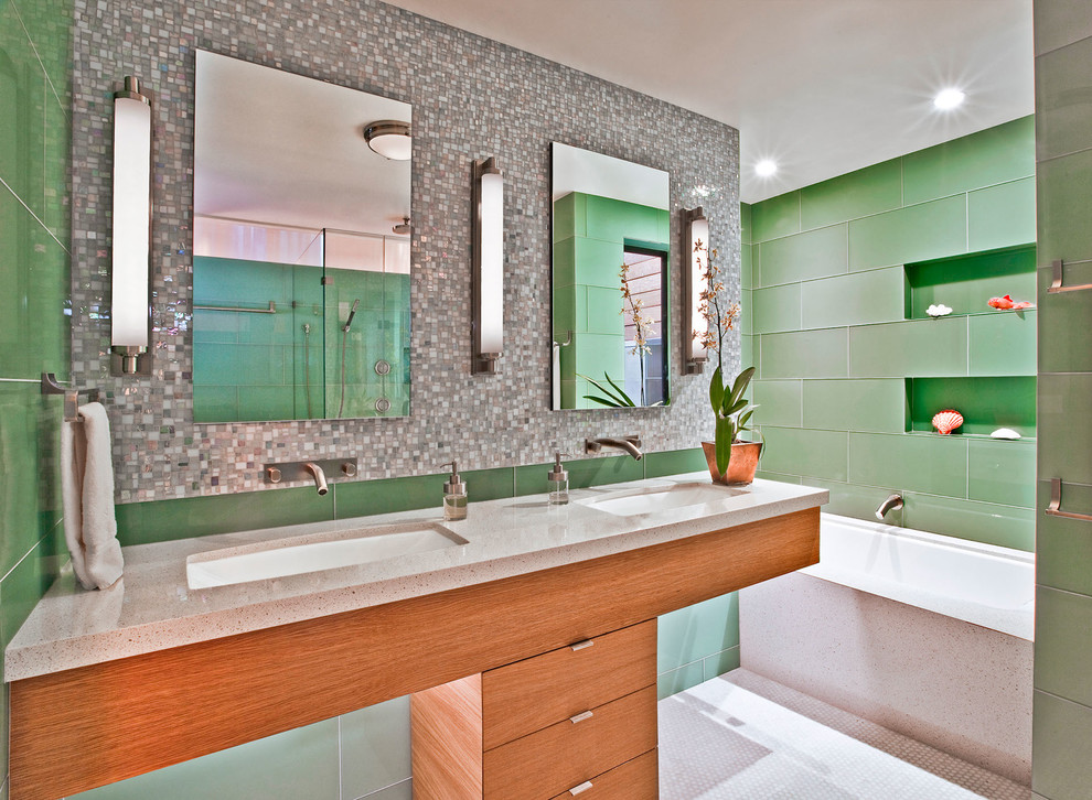 Design ideas for a mid-sized contemporary master bathroom in San Francisco with an undermount sink, flat-panel cabinets, medium wood cabinets, marble benchtops, an undermount tub, green tile, porcelain tile, mosaic tile floors and grey benchtops.