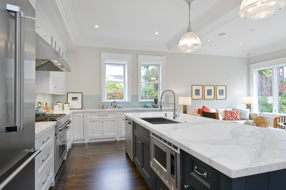 This is an example of a traditional kitchen in San Francisco with shaker cabinets and stainless steel appliances.