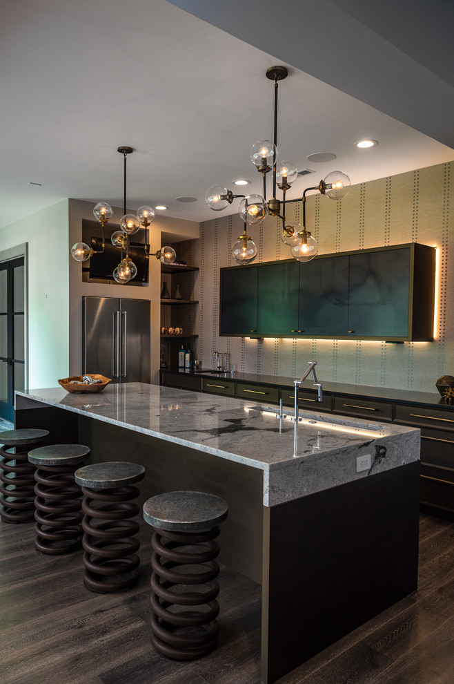 Inspiration for a mid-sized industrial l-shaped open plan kitchen in Indianapolis with an undermount sink, flat-panel cabinets, brown cabinets, granite benchtops, beige splashback, stainless steel appliances, dark hardwood floors, with island and brown floor.